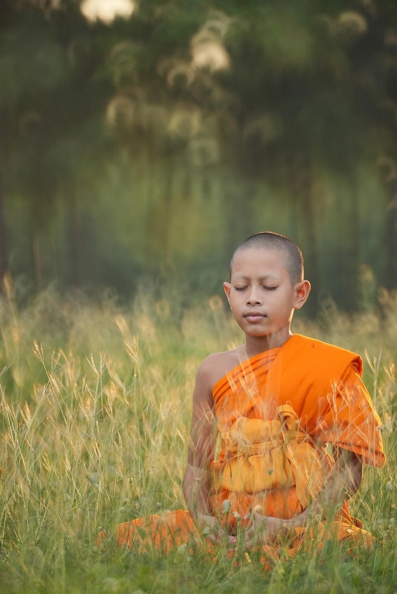 Person doing yoga at sunset